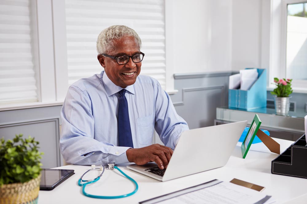 doctor using laptop computer